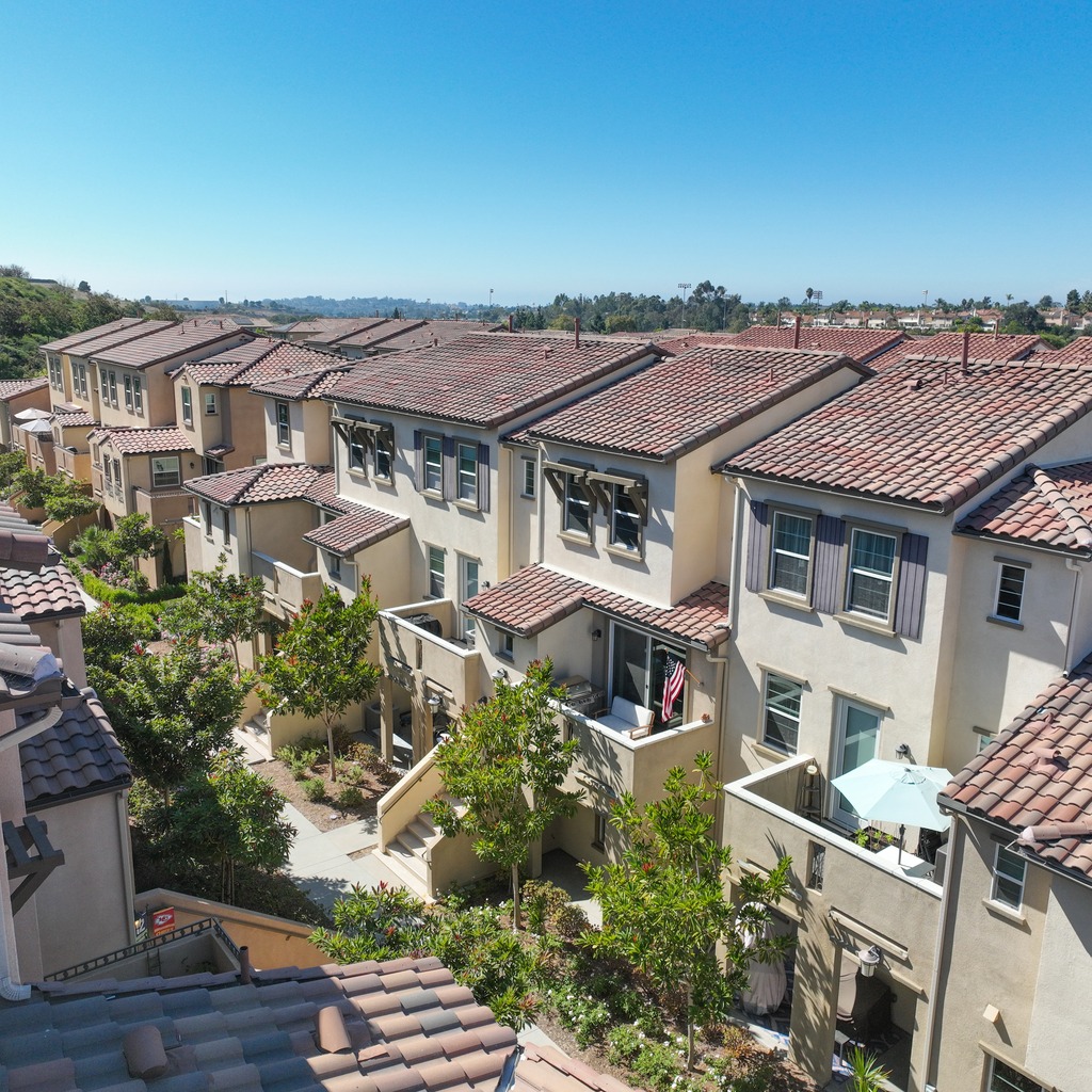 California Mediterranean condominium community with red clay tile roofs
